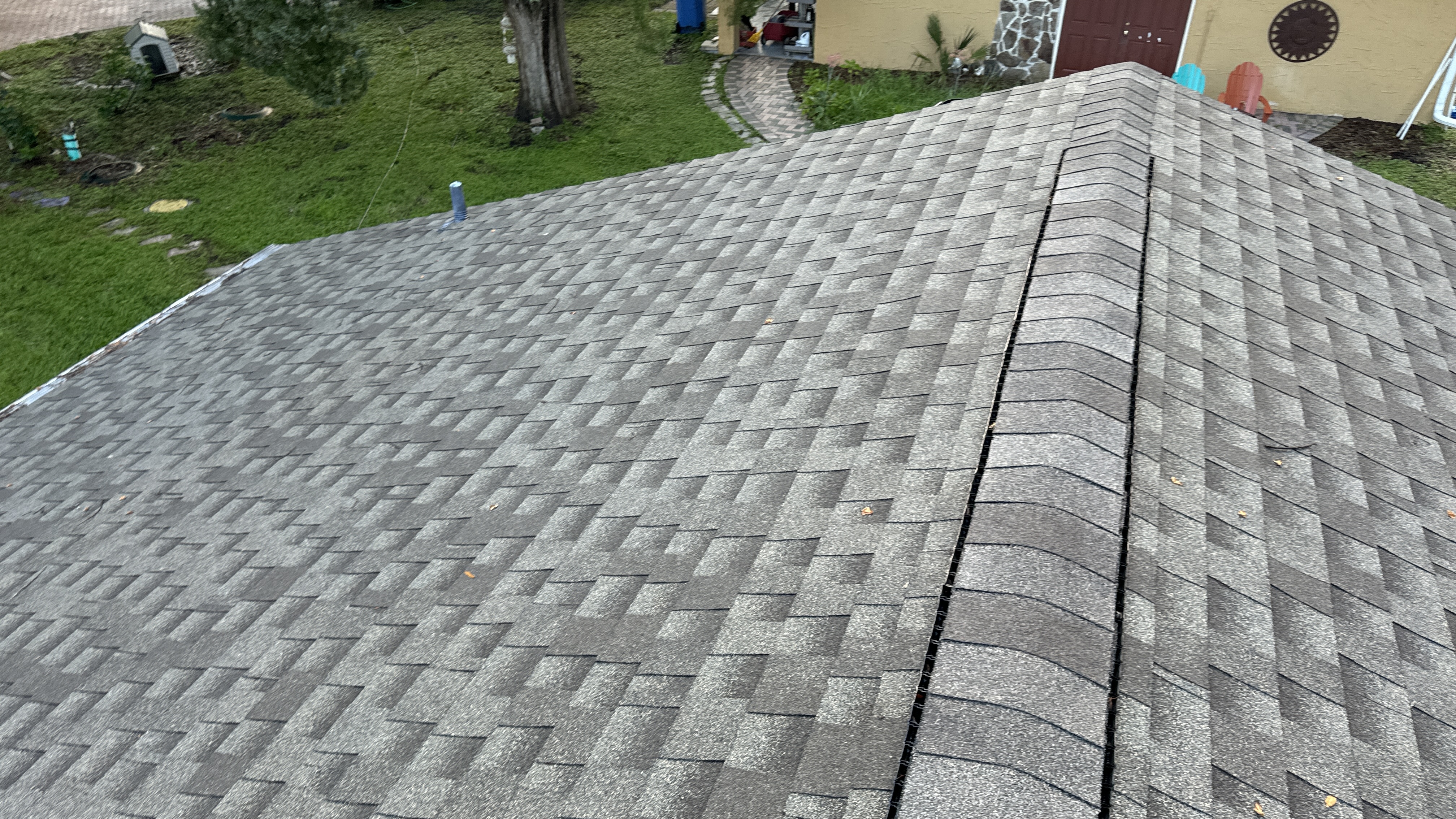 Roof surface in Tampa affected by algae and dark streaking