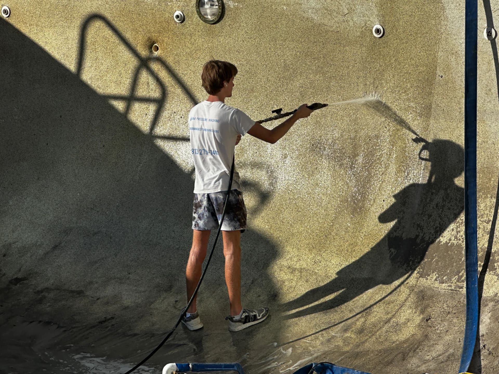 Pool wall surface at Regatta Beach Club during storm cleanup restoration