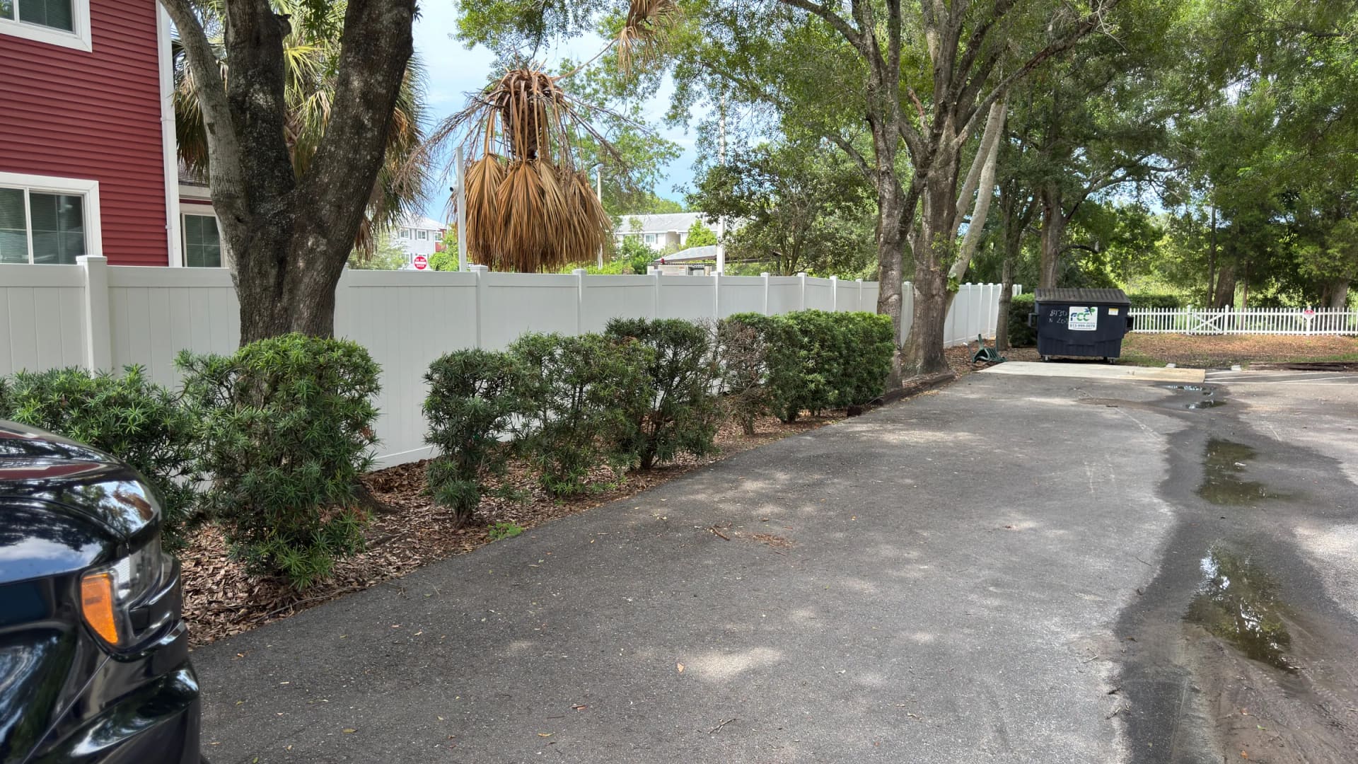 Parking and fence area cleaned at Volunteers of America property