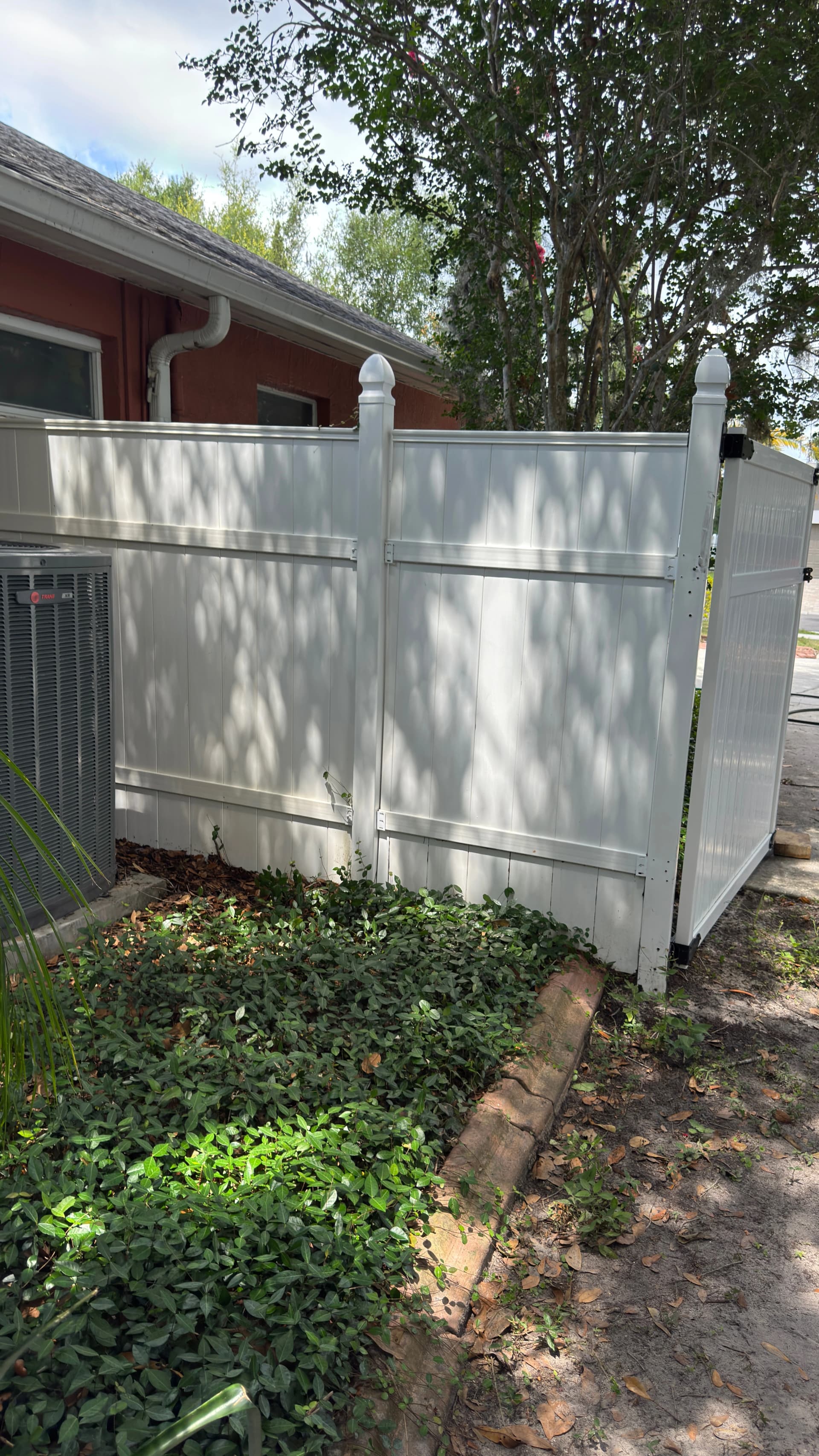Clean vinyl fence panel after exterior washing for a Tampa home in an HOA neighborhood
