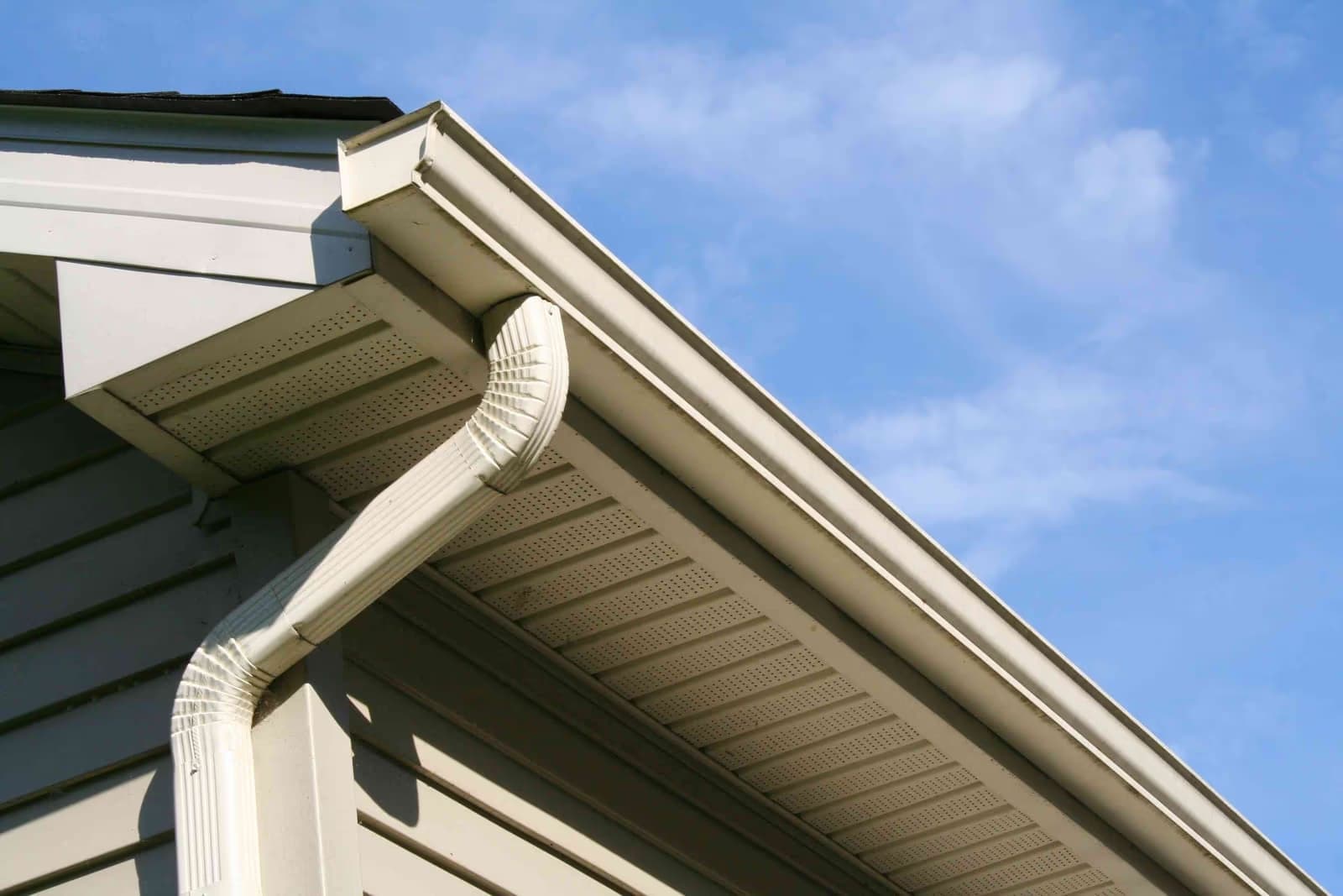 Gutter cleaning service in Tampa on a two-story home with visible gutter and roofline access