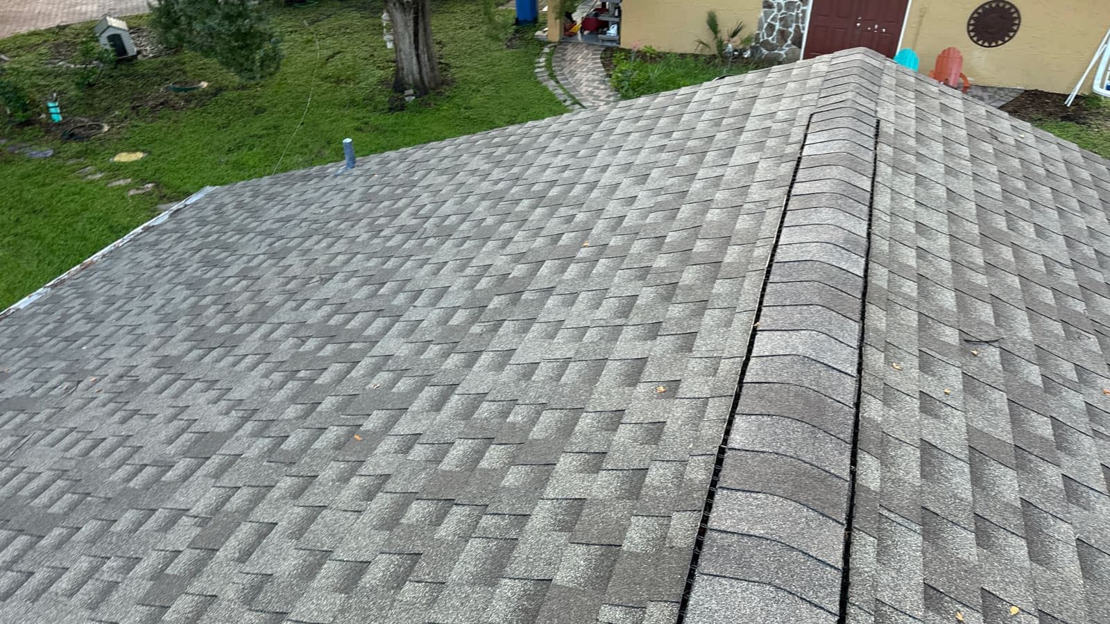 Roof soft washing example representative of Temple Terrace exterior cleaning with shade and tree cover